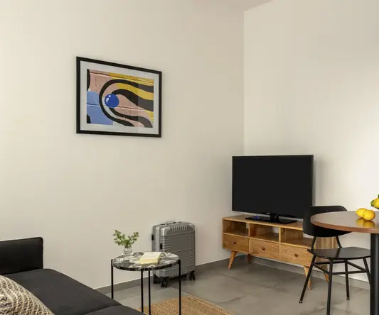 a room with a table and a tv