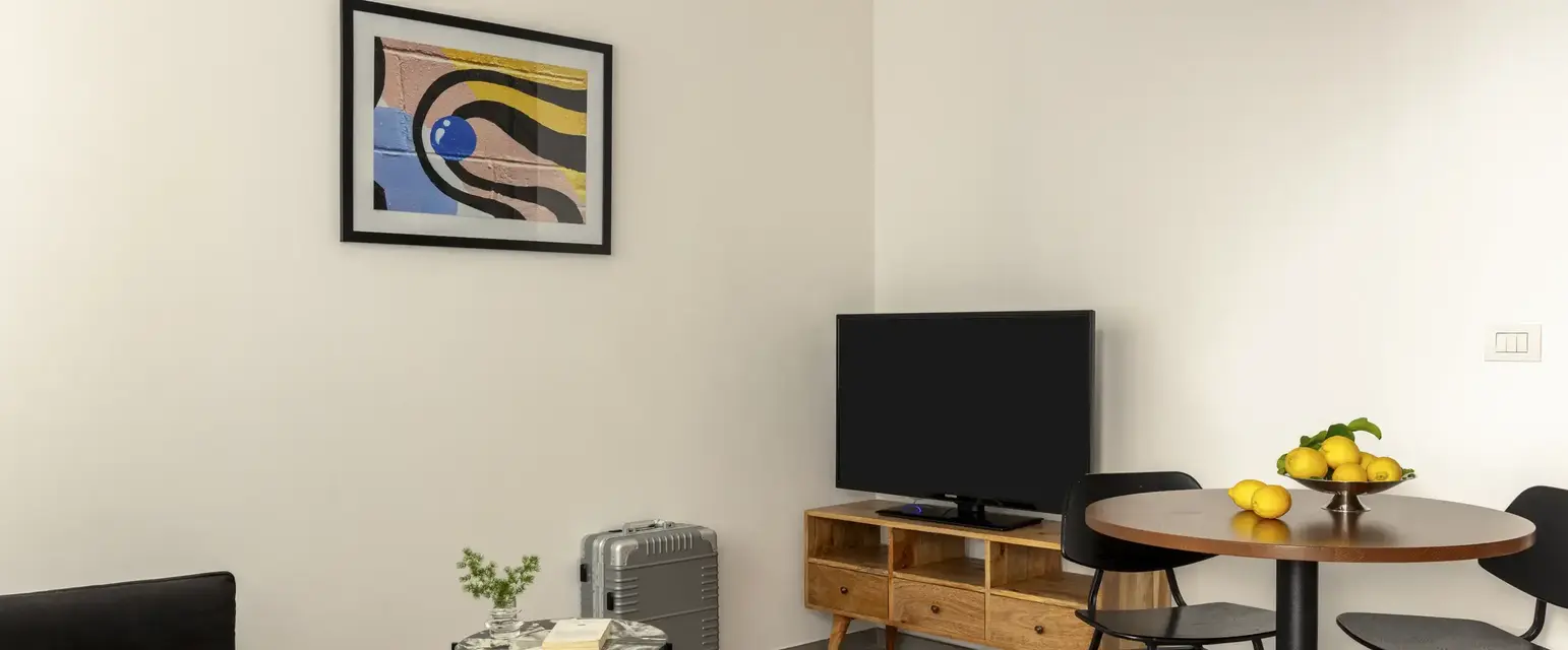 a room with a table and a tv