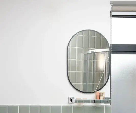 a bathroom with a mirror and a sink