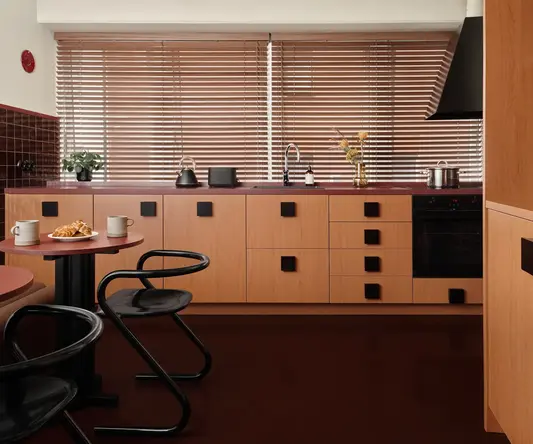a kitchen with a table and chairs