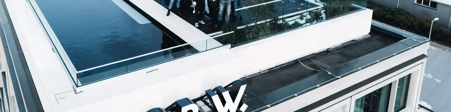 a group of people standing on a roof top of a building