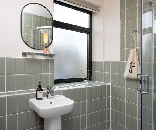 a bathroom with a sink and mirror
