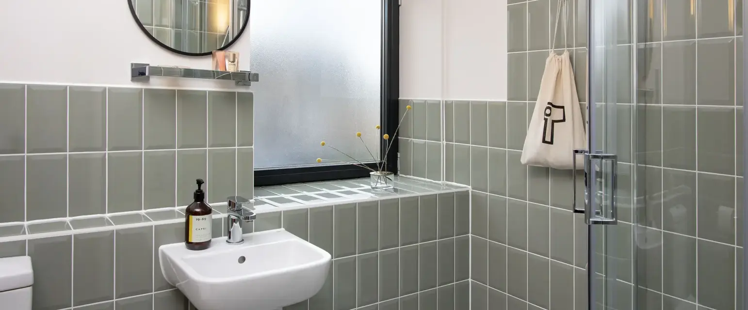 a bathroom with a sink and mirror