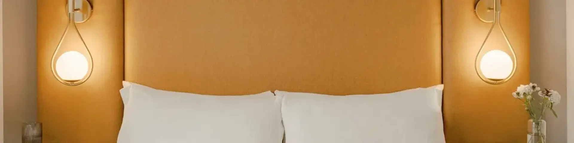 a bed with a tray of food on it