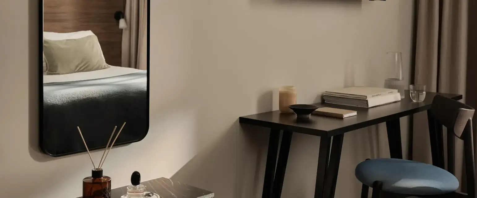 a mirror above a table
