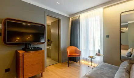 a room with a tv and a couch