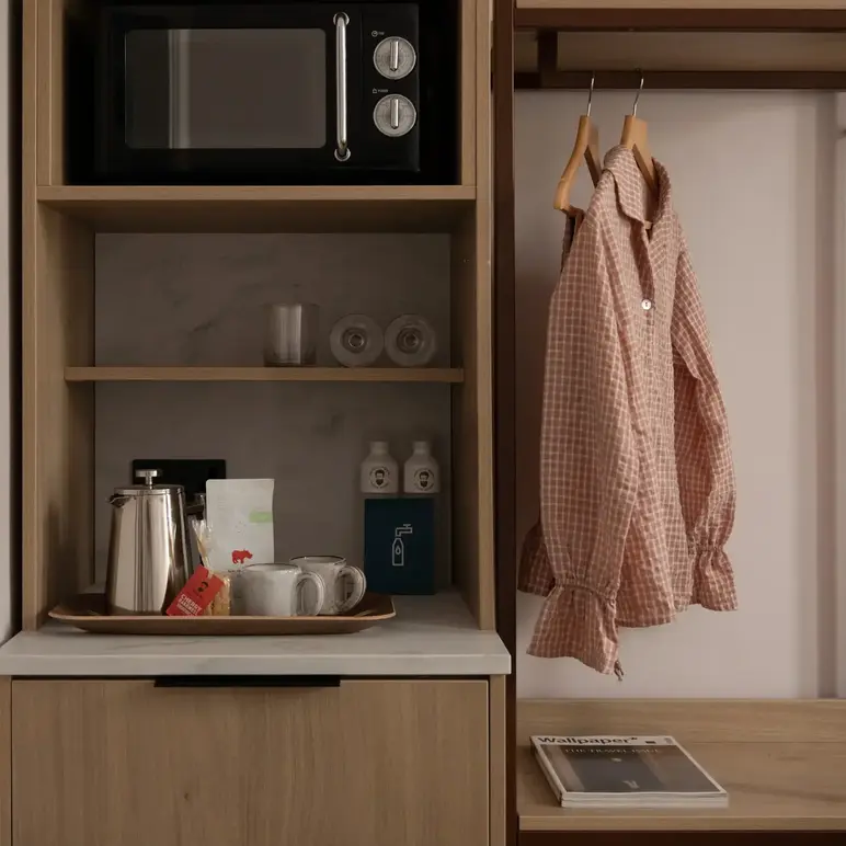 a shelf with a microwave and a shirt on it