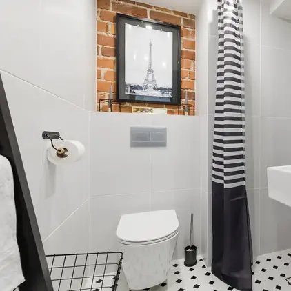 a bathroom with a sink toilet and mirror