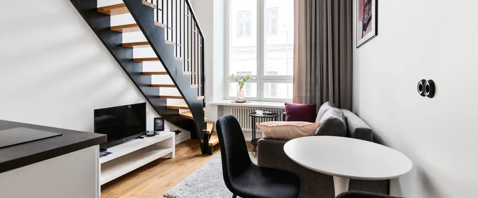 a room with a staircase and couch