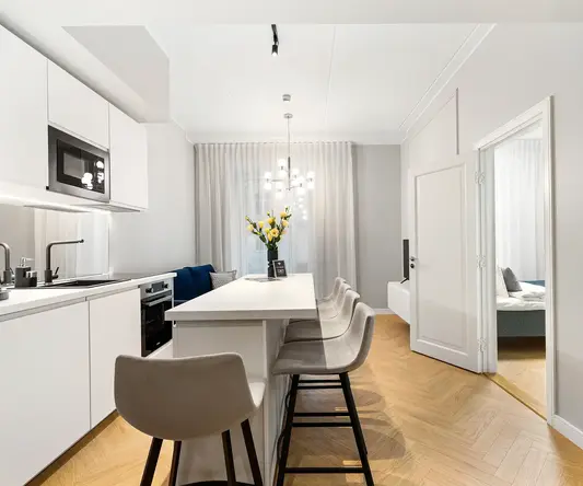 a room with a table and chairs