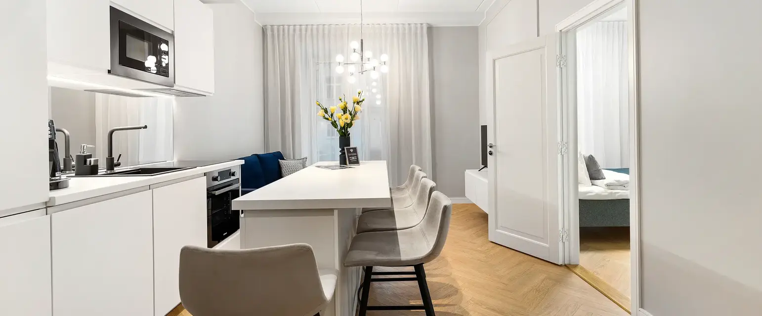 a room with a table and chairs