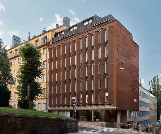 a building with a brick wall and a stone wall