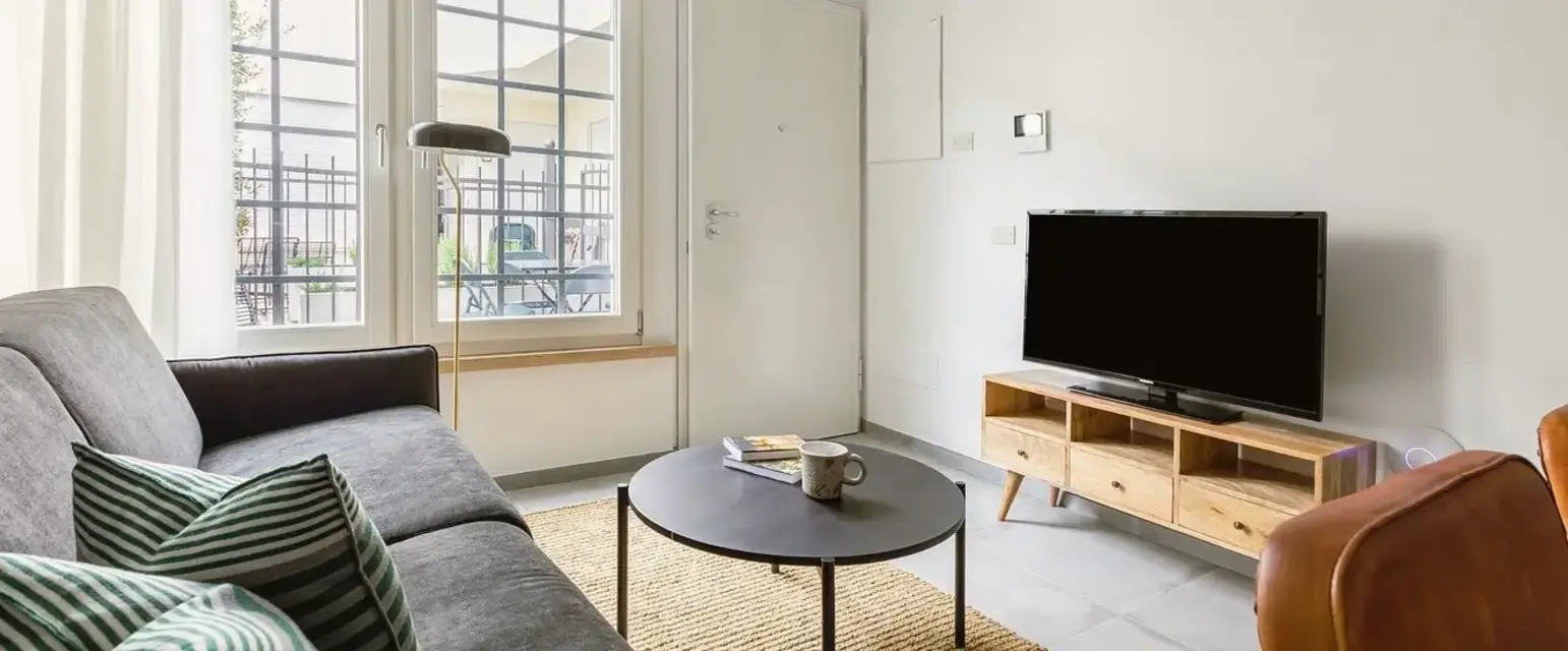 a living room with a couch and a tv