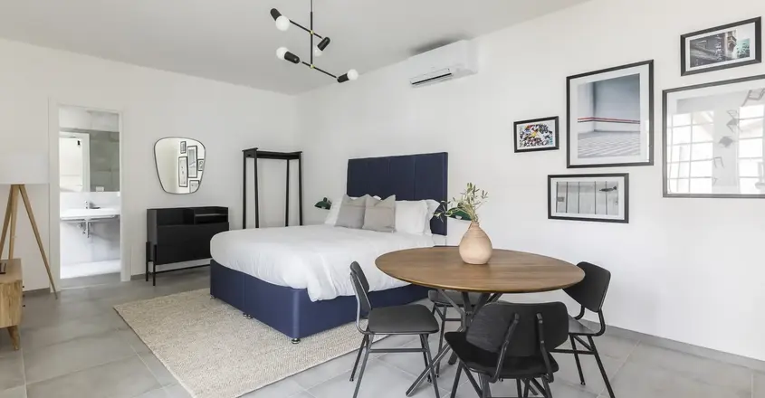 a room with a bed and a table