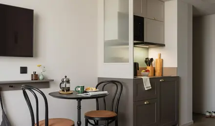 a kitchen with a table and chairs