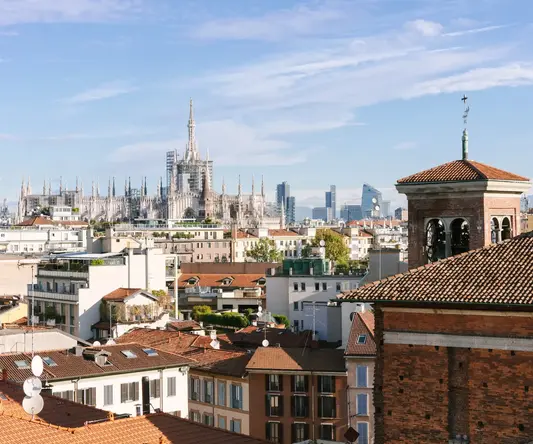 a city with a large building in the background