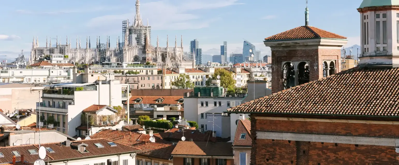 a city with a large building in the background