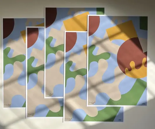 a group of art pieces on a wall