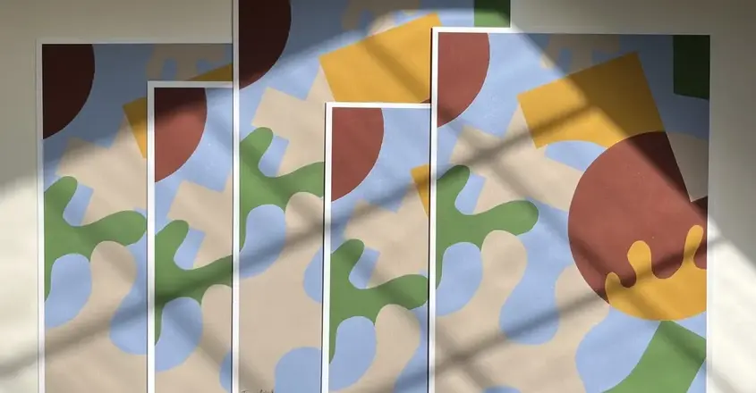 a group of art pieces on a wall