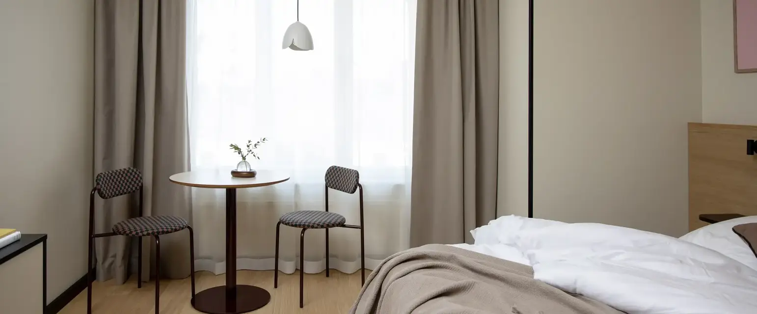 a room with a table and chairs