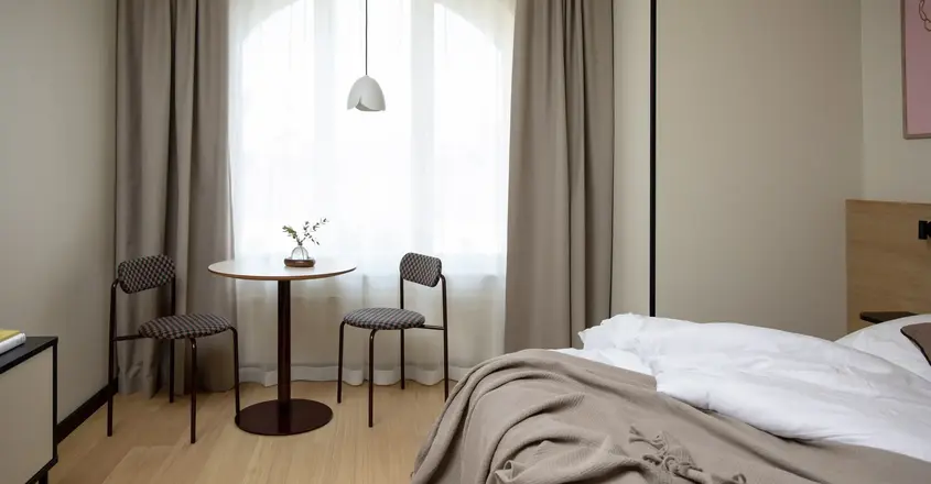 a room with a table and chairs