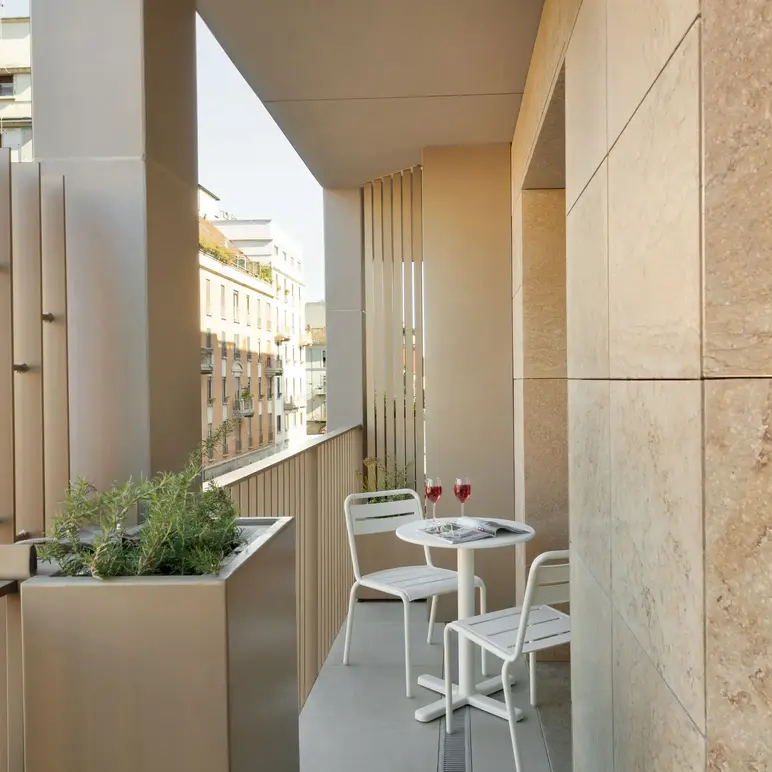 a table and chairs on a balcony