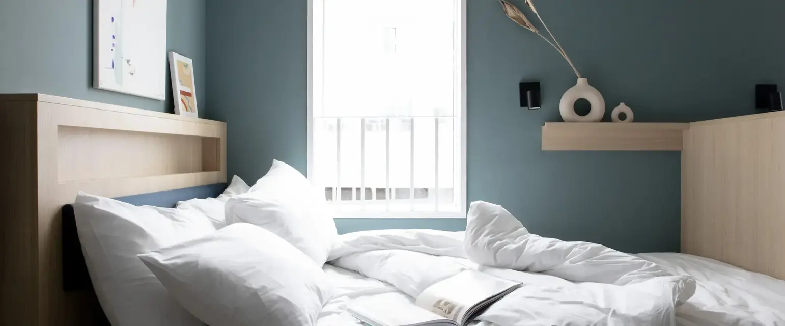 Bed within the Bob W London Tower Hill Studios Compact Studio