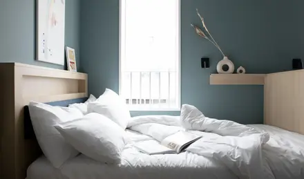 Bed within the Bob W London Tower Hill Studios Compact Studio