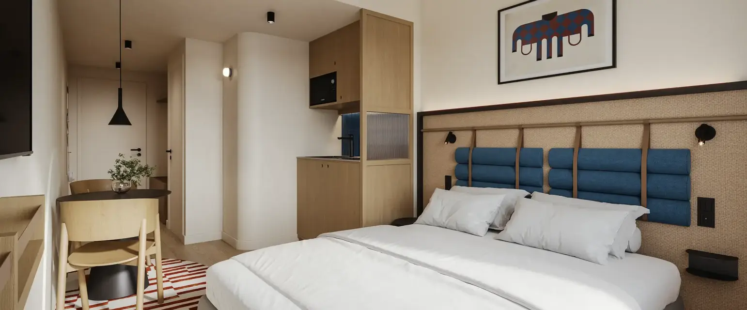 a bedroom with a bed and a rug