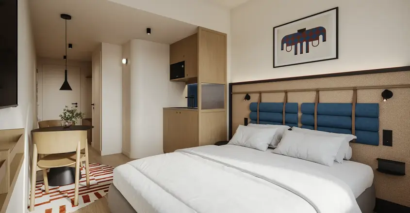 a bedroom with a bed and a rug