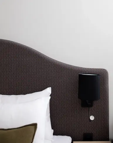 a lamp on a headboard