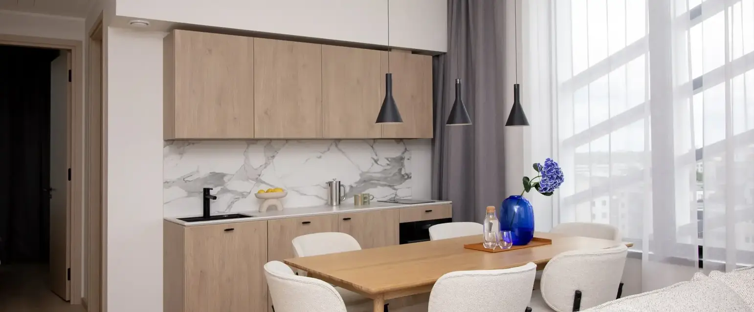 a dining room with a table and chairs