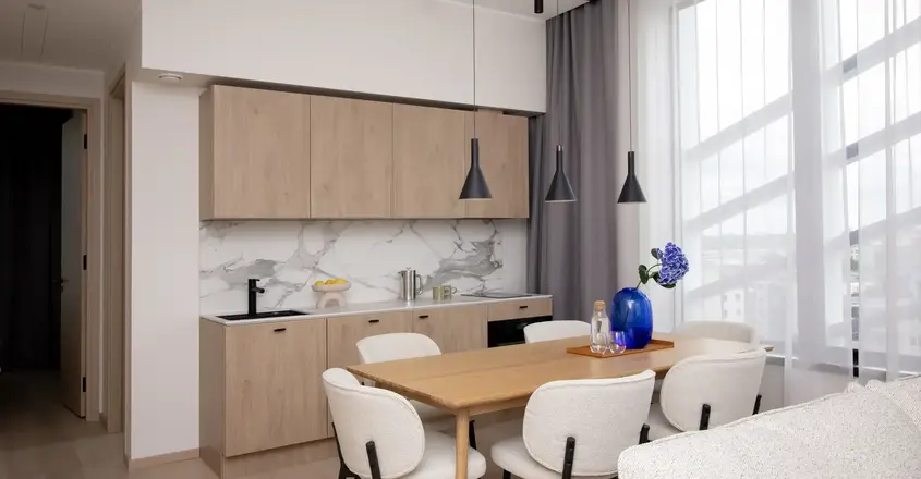 a dining room with a table and chairs