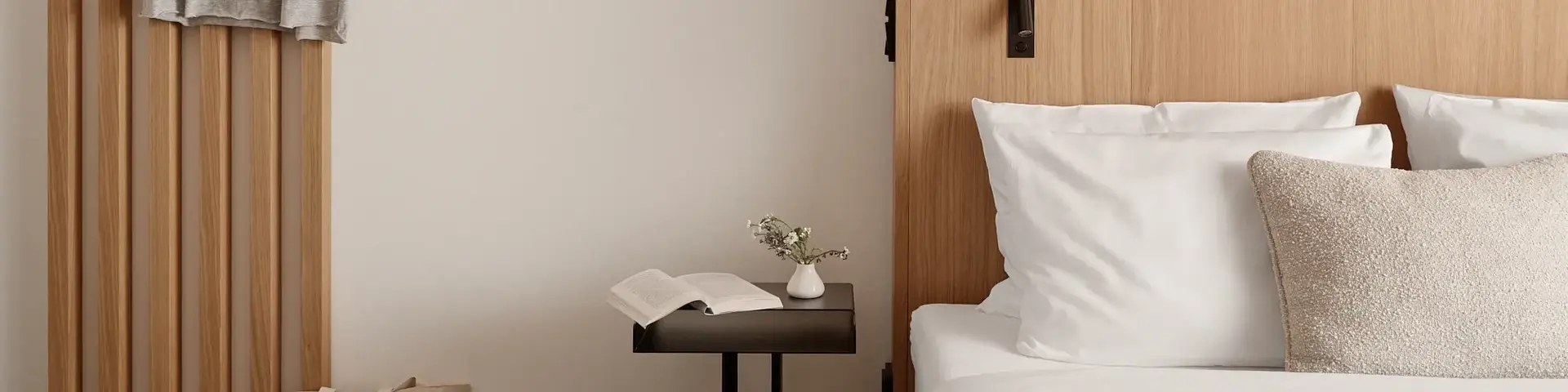 a bedroom with a bed and a table