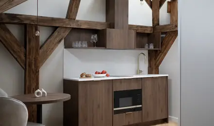 a kitchen with wood cabinets and a table