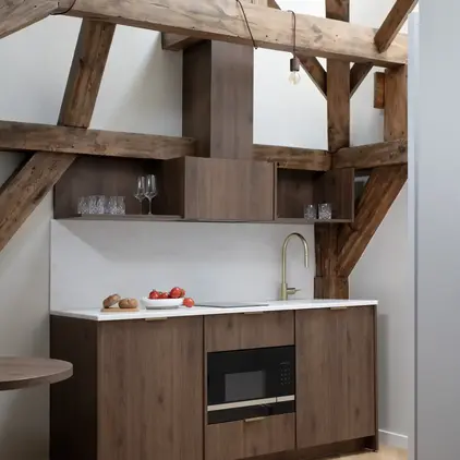 a kitchen with wood cabinets and a table
