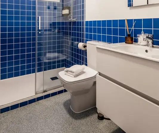 a bathroom with blue tiles