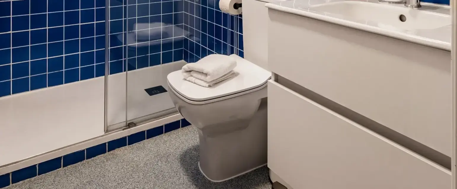 a bathroom with blue tiles