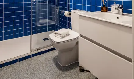 a bathroom with blue tiles