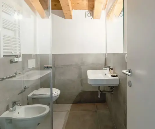 a bathroom with a sink and toilet