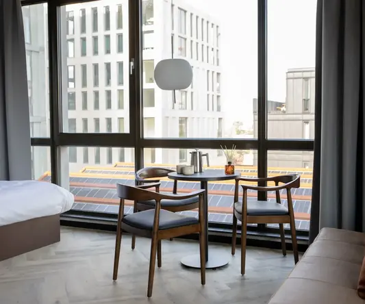 a room with a table and chairs