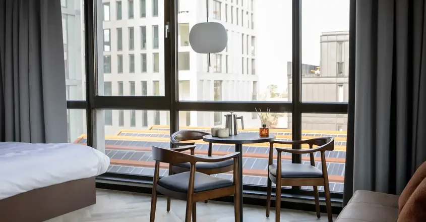 a room with a table and chairs