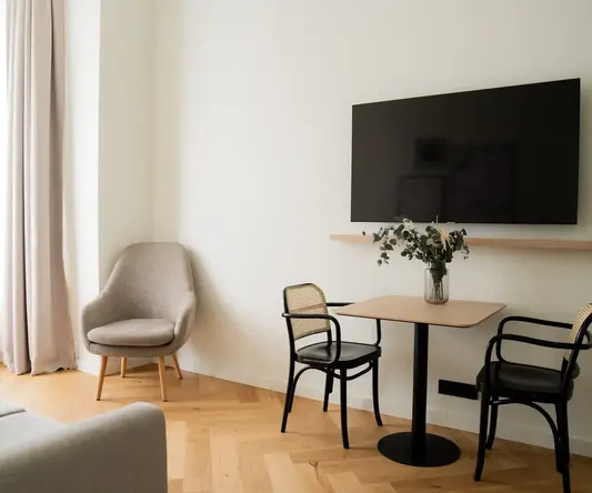 a room with a table and chairs