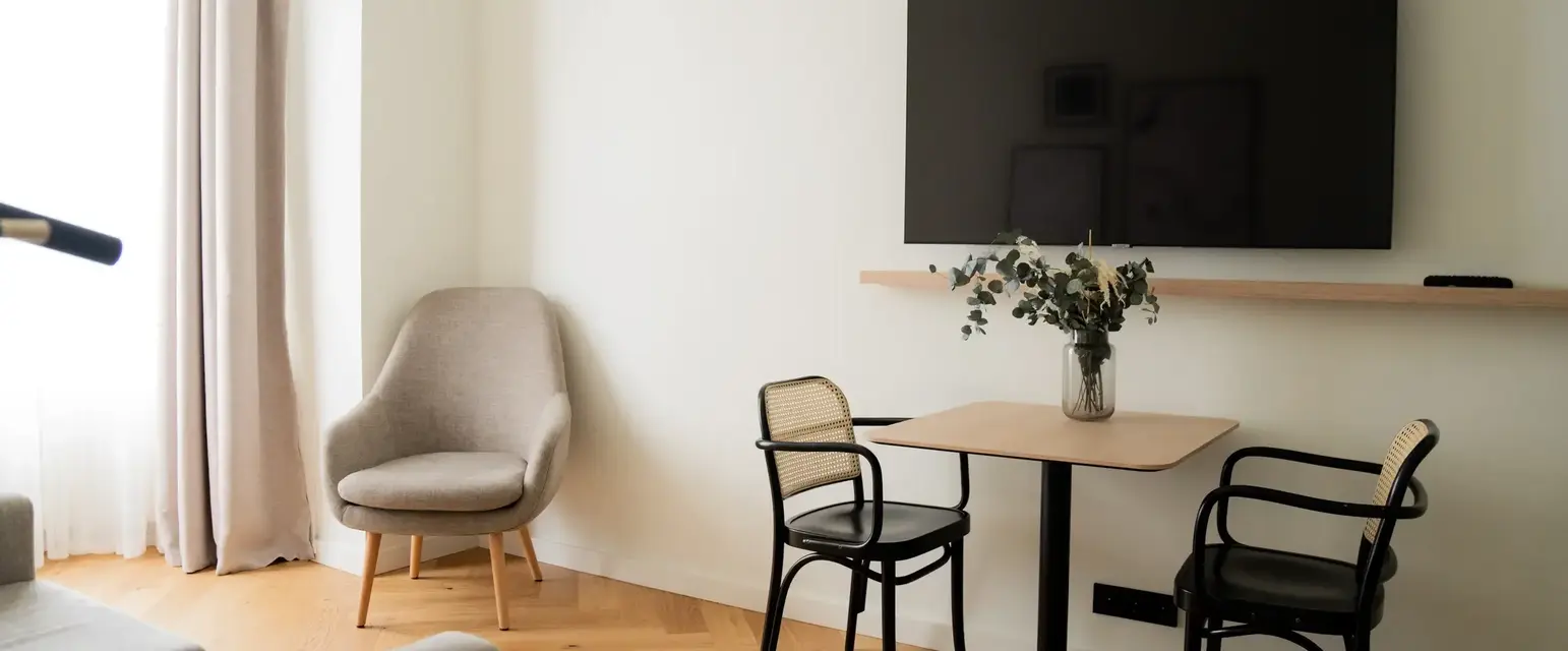 a room with a table and chairs