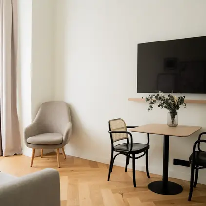 a room with a table and chairs