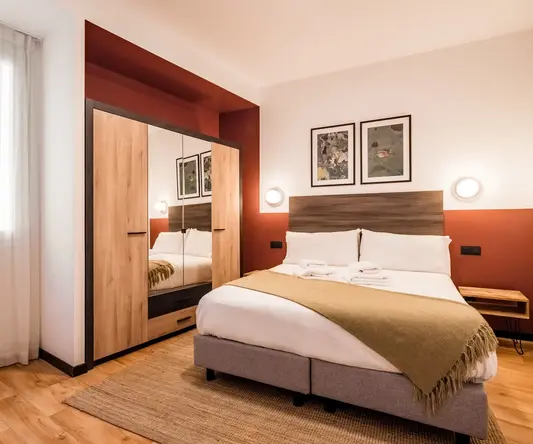 a bedroom with a bed and a closet