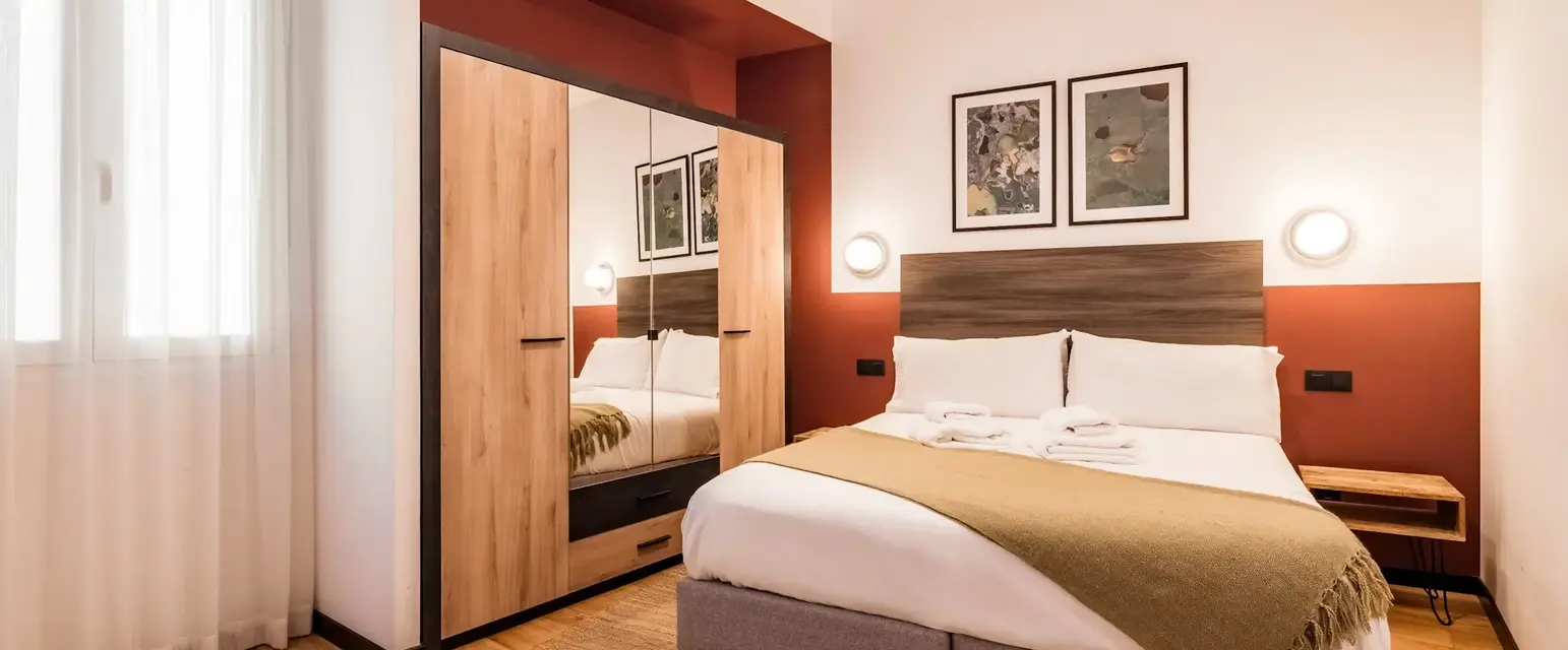 a bedroom with a bed and a closet