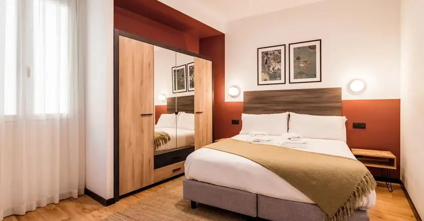 a bedroom with a bed and a closet