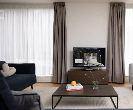 a living room with a television and a coffee table