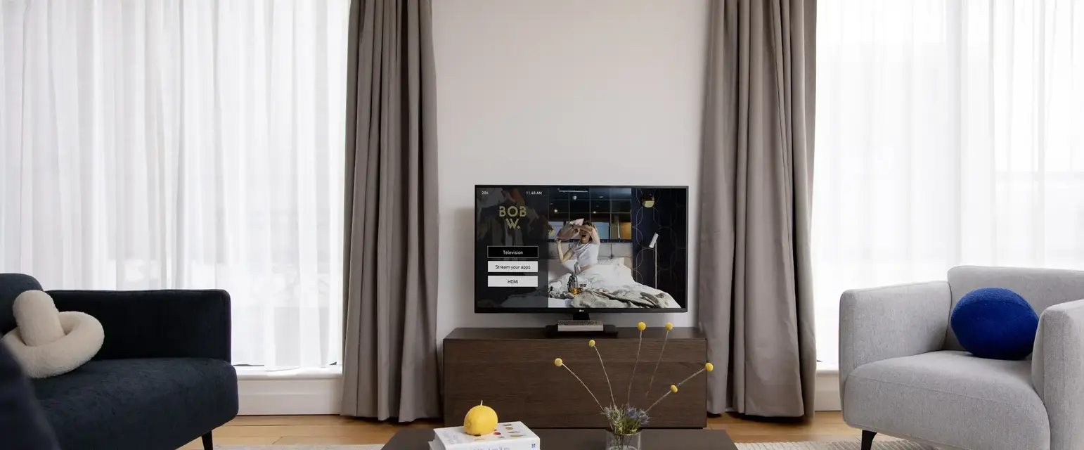 a living room with a television and a coffee table